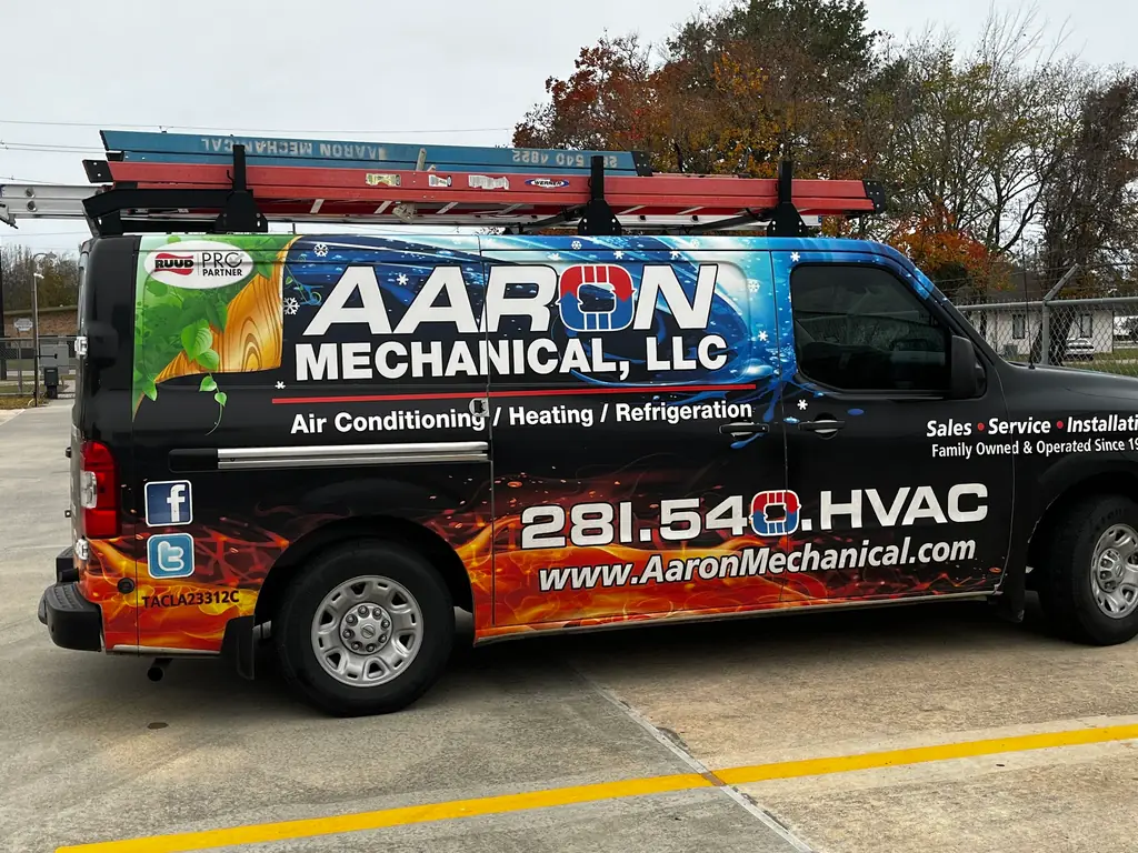 An Aaron Mechanical service van loaded with ladder racks